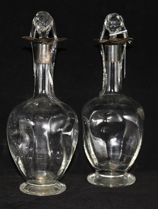 A pair of silver mounted decanters